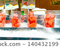 Freshly cut watermelon in takeout cups arranged on ice (store display) 140432199