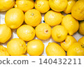 A close-up background of a box packed full of fresh lemons. 140432211