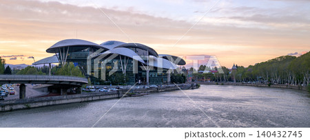 Panoramic sunset view of Public Service Hall agency of the Georgian government and Mtkvari river in Tbilisi, Georgia Panoramic sunset view of Public Service Hall agency of the Georgian government and Mtkvari river in Tbilisi, Georgia 140432745