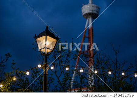 Old light post with Tbilisi TV broadcasting communications tower in the background in Tbilisi, Georgia 140432759