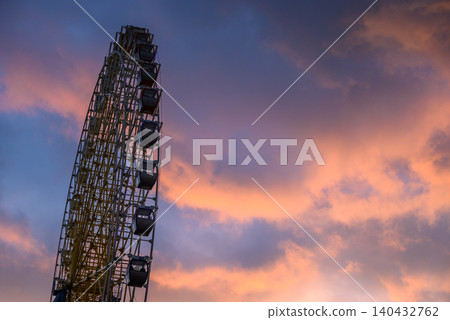 Ferris wheel silhouette at sunset sky 140432762