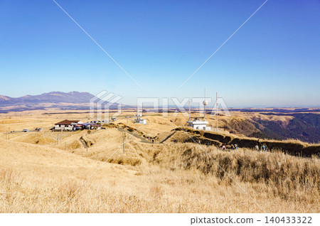 A panoramic winter landscape unfolds at Daikanbo in Aso City under a clear blue sky. A panoramic winter landscape unfolds at Daikanbo in Aso City under a clear blue sky. 140433322