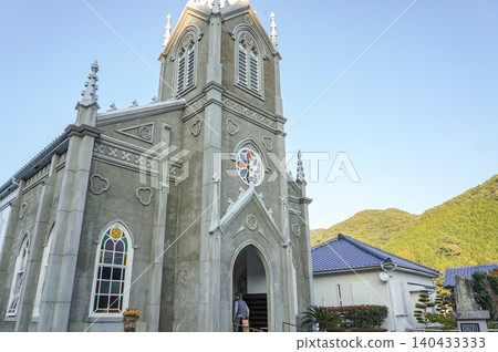 The majestic Gothic architecture of Sakitsu Church against the blue sky of Amakusa The majestic Gothic architecture of Sakitsu Church against the blue sky of Amakusa 140433333
