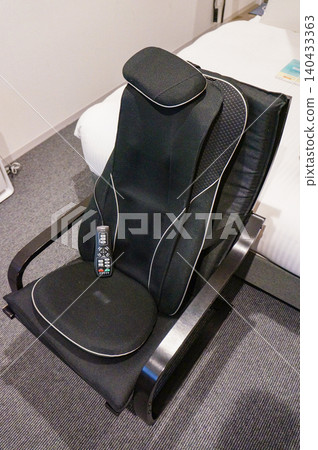 Relax in your hotel room with a state-of-the-art massage chair experience. Relax in your hotel room with a state-of-the-art massage chair experience. 140433363
