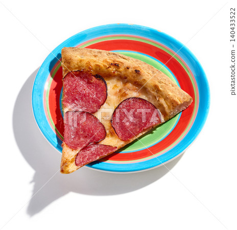 slice of salami pepperoni pizza on colorful plate isolated on white background slice of salami pepperoni pizza on colorful plate isolated on white background 140433522