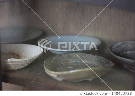 Dishes placed in the cupboard Dishes placed in the cupboard 140433728