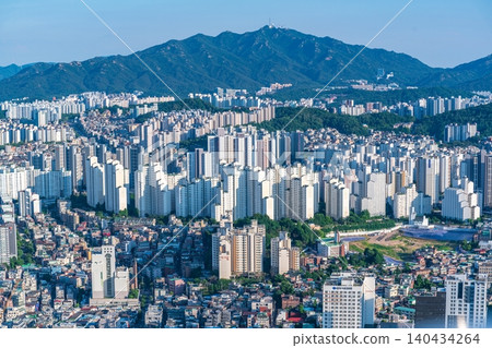 High-angle panoramic view of dense residential apartment complexes and urban cityscape in southern Seoul on a clear summer day High-angle panoramic view of dense residential apartment complexes and urban cityscape in southern Seoul on a clear summer day 140434264