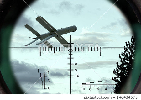 Fixed wing unmanned aerial vehicle appears in center of targeting reticle. Fixed wing unmanned aerial vehicle appears in center of targeting reticle. 140434575