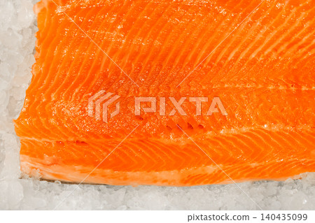 Salmon fillet raw fresh fish seafood texture pattern sea orange food background Salmon fillet raw fresh fish seafood texture pattern sea orange food background 140435099