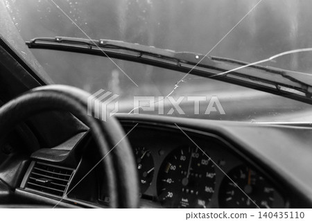 Crack on windshield broken car window glass damage vehicle Crack on windshield broken car window glass damage vehicle 140435110