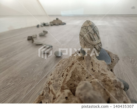 Stone sculpture installation, rocks floor, empty gallery space, minimalist art, indoor exhibition, natural material Stone sculpture installation, rocks floor, empty gallery space, minimalist art, indoor exhibition, natural material 140435307