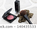 Makeup brushes, blush, and lip makeup 140435533