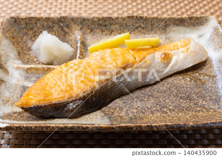Delicious grilled salmon from Hokkaido, made with Tokishirazu salmon, served with grated daikon radish. Delicious grilled salmon from Hokkaido, made with Tokishirazu salmon, served with grated daikon radish. 140435900