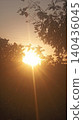 sunset sky with sun and tree silhouette 140436045