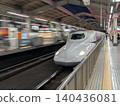 On a summer night, I watch the bullet train speed off as it accelerates. 140436081