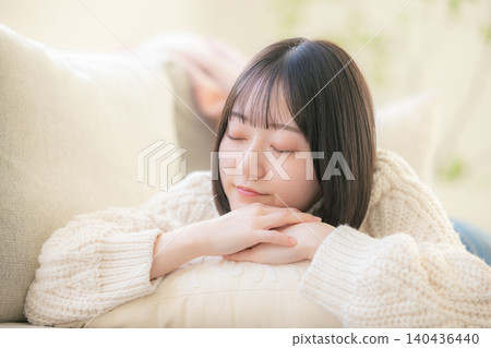 A woman lying on the sofa A woman lying on the sofa 140436440