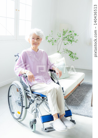 Senior woman sitting in a wheelchair Senior woman sitting in a wheelchair 140436513