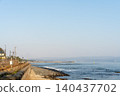 Railroad running along the sea 140437702