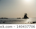 The sun rising over the rocks 140437706