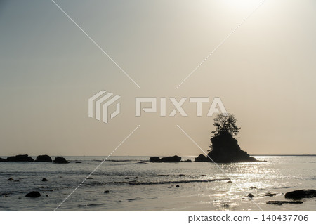The sun rising over the rocks The sun rising over the rocks 140437706