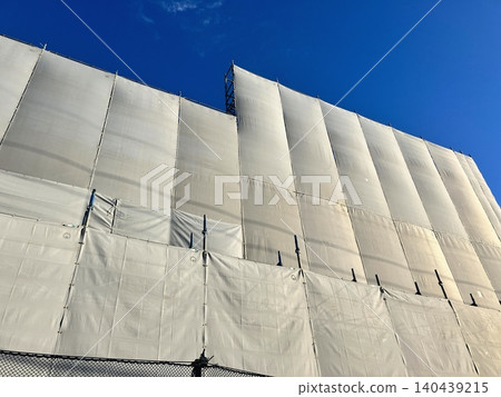 Mesh sheet at a building demolition site Mesh sheet at a building demolition site 140439215