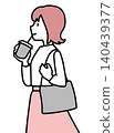 A woman drinking a beverage while walking. 140439377