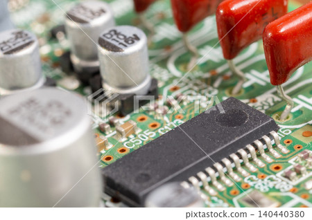 Close-up view of a circuit board with electronic components and connectors. Close-up view of a circuit board with electronic components and connectors. 140440380