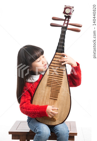 Asian little girl playing pipa, traditional Chinese musical instrument, happy child learning music Asian little girl playing pipa, traditional Chinese musical instrument, happy child learning music 140440820