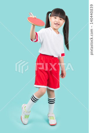 Asian little girl holding table tennis paddle, playing ping pong, kids sport and fun activity concept Asian little girl holding table tennis paddle, playing ping pong, kids sport and fun activity concept 140440839