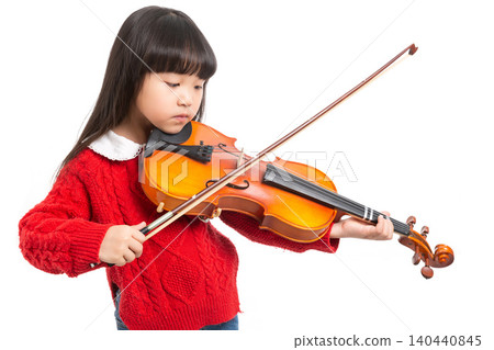 Asian little girl holding violin and bow, learning classical music Asian little girl holding violin and bow, learning classical music 140440845