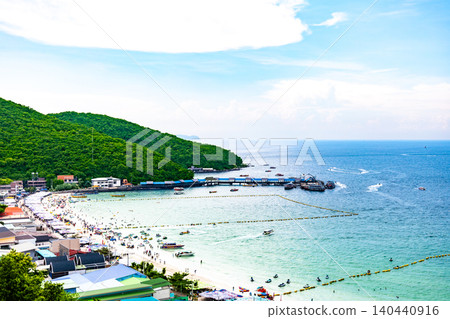 A beach surrounded by greenery and the blue sea. A beach surrounded by greenery and the blue sea. 140440916