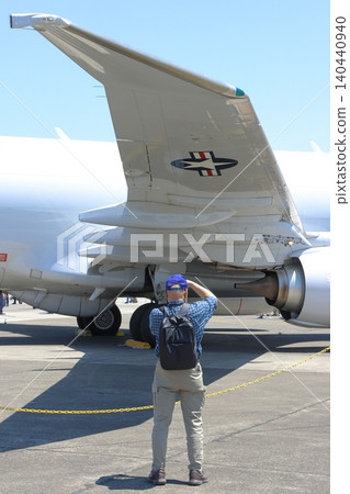 A man photographs a U.S. military aircraft at an air show. A man photographs a U.S. military aircraft at an air show. 140440940