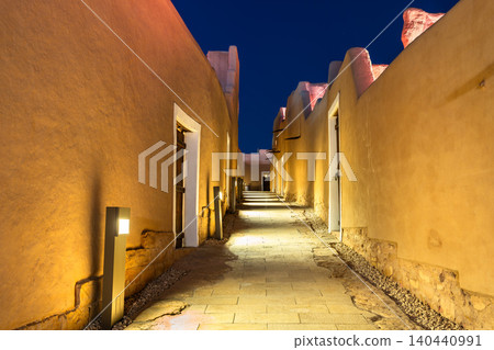 An illuminated traditional street in the historic At Turaif district of Diriyah, Saudi Arabia at night An illuminated traditional street in the historic At Turaif district of Diriyah, Saudi Arabia at night 140440991