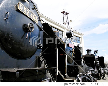 Japanese steam locomotives lined up in the depot Japanese steam locomotives lined up in the depot 140441119