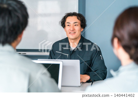 Businessmen in work clothes having a meeting in an office, workplace, or conference room. Businessmen in work clothes having a meeting in an office, workplace, or conference room. 140441402