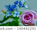 A rose-filled entranceway. 140442291