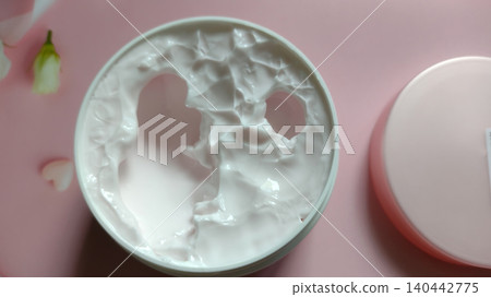 Moisturizing body butter or face mask in a plastic container, beauty and skincare concept. Moisturizing body butter or face mask in a plastic container, beauty and skincare concept. 140442775