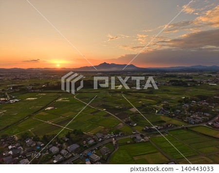 Aerial view of Miyakonojo City: Sunset and the Kirishima mountain range Aerial view of Miyakonojo City: Sunset and the Kirishima mountain range 140443033