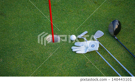 Golf balls on a green lawn in a beautiful golf course with morning sunshine. Golf balls on a green lawn in a beautiful golf course with morning sunshine. 140443101