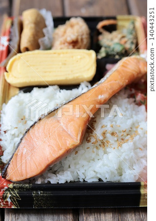 Takeaway Japanese bento box in a disposable container: Salmon bento 140443251
