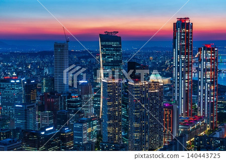 Beautiful night view of Yeouido financial district skyscrapers with bright office lights in Seoul, South Korea Beautiful night view of Yeouido financial district skyscrapers with bright office lights in Seoul, South Korea 140443725