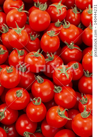 A bountiful harvest scene of red vegetables, with fresh tomatoes piled high. A bountiful harvest scene of red vegetables, with fresh tomatoes piled high. 140444231