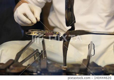 The hands of a craftsman making ningyo-yaki Handmade ningyo-yaki 140444620