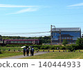 Kintetsu's sightseeing limited express train "Aoniyoshi" runs alongside the reconstructed ruins within the Heijo Palace Site, a World Heritage Site. 140444933