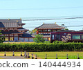 Kintetsu's sightseeing limited express train "Aoniyoshi" runs alongside the reconstructed ruins within the Heijo Palace Site, a World Heritage Site. 140444934