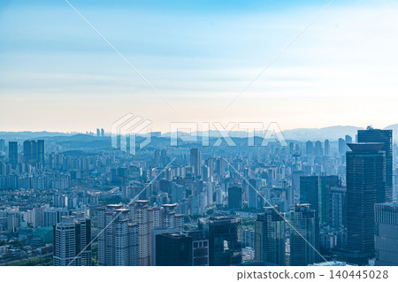 High-angle panoramic view of Yeouido financial district skyscrapers and the Han River on a clear summer afternoon in Seoul, South Korea High-angle panoramic view of Yeouido financial district skyscrapers and the Han River on a clear summer afternoon in Seoul, South Korea 140445028