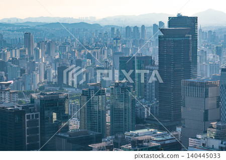 High-angle panoramic view of Yeouido financial district skyscrapers and the Han River on a clear summer afternoon in Seoul, South Korea 140445033