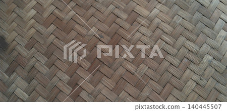 Traditional woven bamboo surface featuring a classic basket weave pattern. Traditional woven bamboo surface featuring a classic basket weave pattern. 140445507