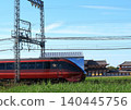 Kintetsu Limited Express "Hinotori" travels past the reconstructed ruins within the Heijo Palace Site, a World Heritage Site. 140445756
