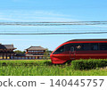 Kintetsu Limited Express "Hinotori" travels past the reconstructed ruins within the Heijo Palace Site, a World Heritage Site. 140445757